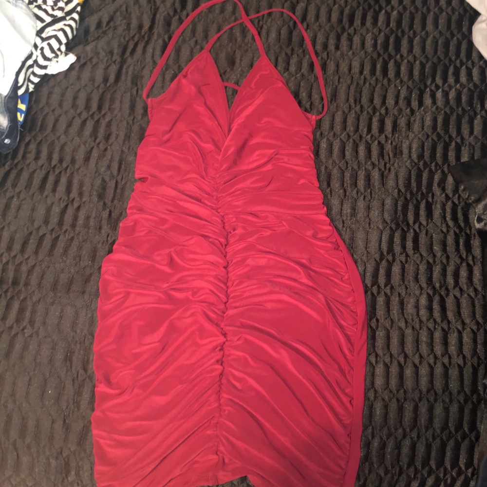 Beautiful Red dress . shows skin from the back .